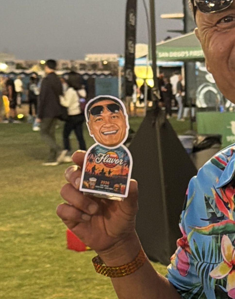 Guest in a Hawaiian shirt showing his TinyTwin at an outdoor festival